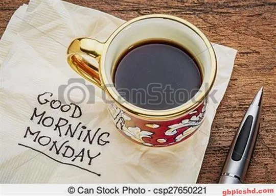 Kaffeetasse auf einer Serviette mit der Aufschrift "Guten Morgen Montag" und einem Stift.