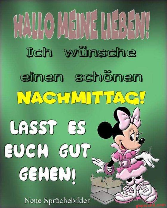 Minnie Maus in rosa Kleidung mit einem Nachmittaggruß auf grünem Hintergrund.