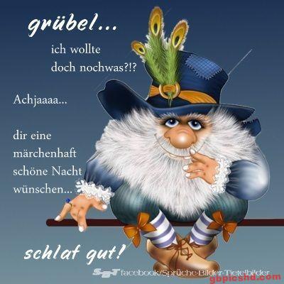 Cartoonfigur mit weißem Bart und buntem Hut wünscht eine schöne Nacht.
