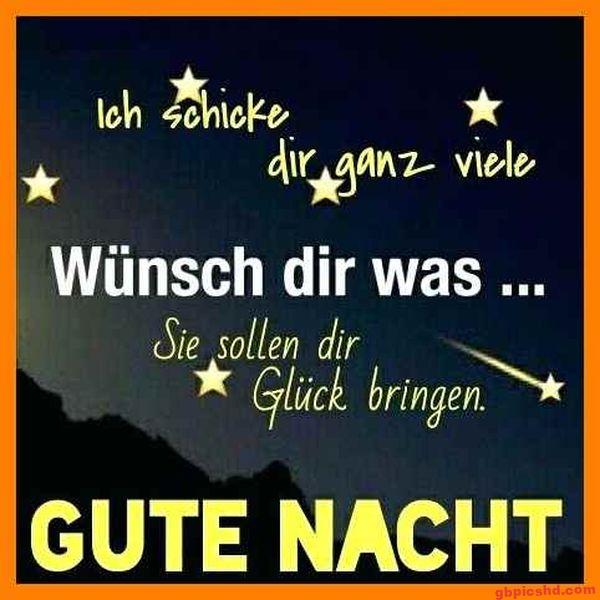 Gutenachtwunsch mit Sternen auf dunklem Hintergrund in gelber Schrift.