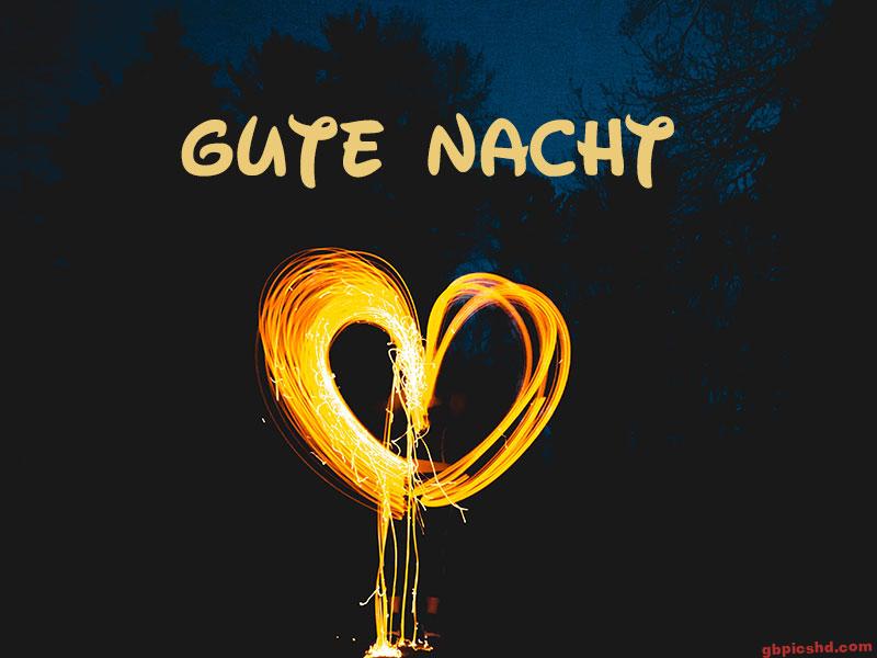 Leuchtendes Herz aus Licht vor dunklem Nachthimmel mit dem Text Gute Nacht.