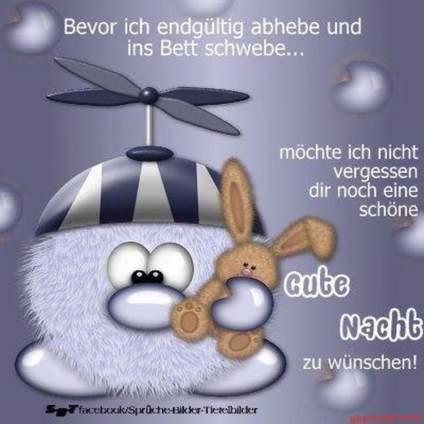 Flauschiges Cartoonwesen mit Propellerhut und Häschen-Plüschtier wünscht gute Nacht.