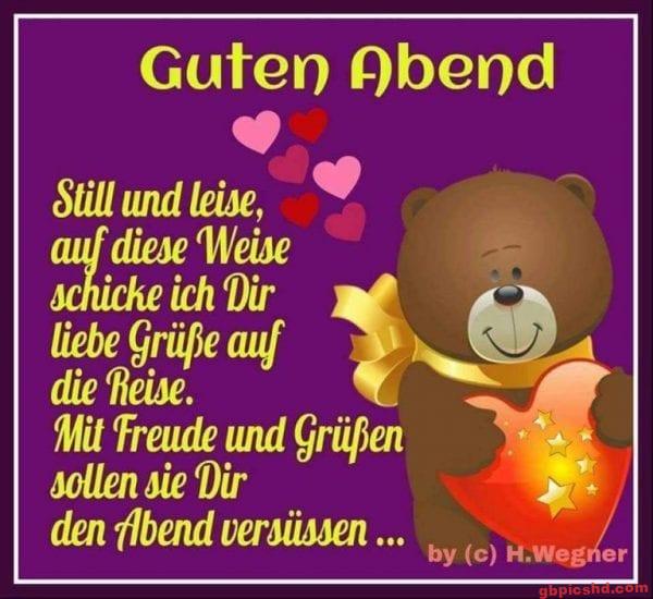 Teddybär mit Herz und gelber Schleife sendet liebe Grüße zum Guten Abend.
