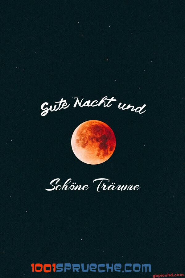 Roter Mond am Nachthimmel mit dem Text Gute Nacht und Schöne Träume als Gruß für die Nacht.