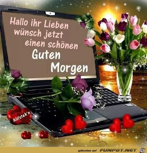 Ein Laptop mit der Aufschrift „Guten Morgen“ und bunten Blumen. Herzchen sind ebenfalls sichtbar.