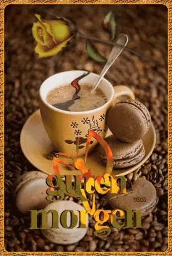 Tasse Kaffee mit einem Keks und einer Rose auf Kaffeebohnen. Text: Guten Morgen.