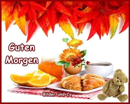 Frühstückstisch mit Croissants, Orangenscheiben, Honig und einer Blume. Text: Guten Morgen.