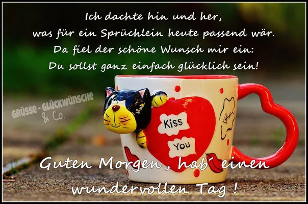 Eine Tasse mit Katzendesign, darauf steht „Kiss You“ und eine Grußbotschaft.