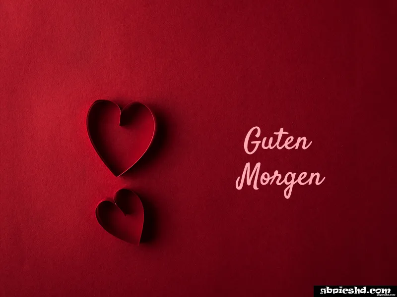 Zwei rote Papierherzen auf rotem Hintergrund mit dem Text „Guten Morgen“.
